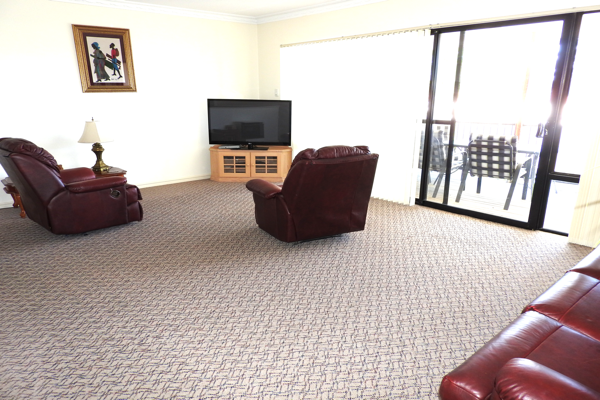 The lounge room of the aprtment at Palm Beach Bed and Breakfast in Rockingham
